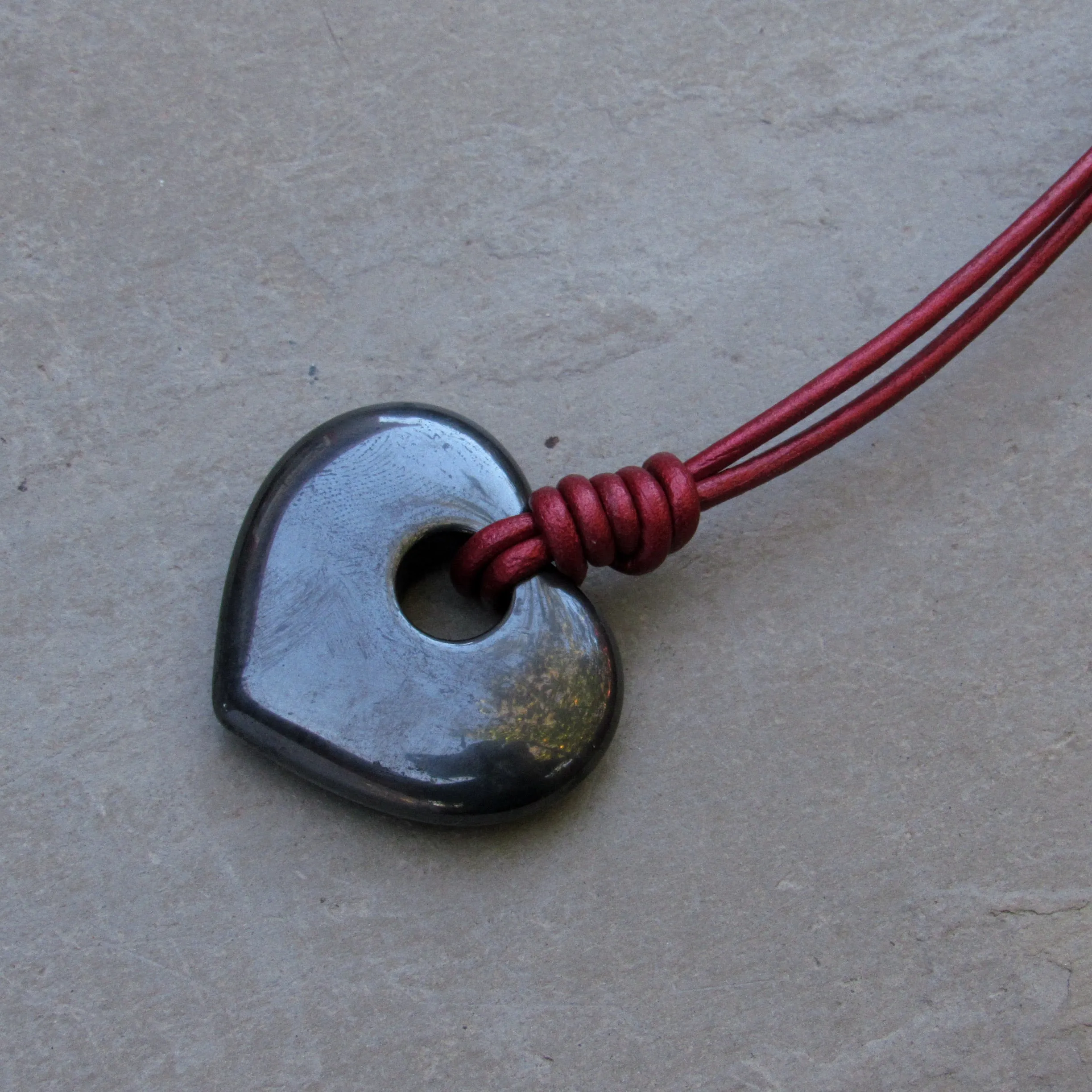 Hematite heart Hand Knotted on Metallic Red Leather With Sterling Silver Clasp